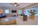 Charming living room with hardwood floors and sliding door access to the screened-in lanai at 4750 Augusta Ave, Oldsmar, FL 34677