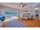 Comfortable living room with hardwood floors and access to the screened in lanai with pool at 4750 Augusta Ave, Oldsmar, FL 34677