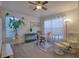 Bright home office with large windows, modern desk, and comfortable seating area at 4750 Augusta Ave, Oldsmar, FL 34677