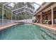 Spacious backyard pool with outdoor lounge area, spa, and mature landscaping at 4750 Augusta Ave, Oldsmar, FL 34677