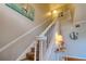 Carpeted staircase with white railing, leading to the upper level of the home at 4750 Augusta Ave, Oldsmar, FL 34677