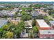 Aerial view of a neighborhood street, with homes featuring diverse architecture and mature trees at 506 S Melville Ave, Tampa, FL 33606