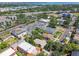Aerial view of a residential neighborhood with green trees, and diverse housing at 506 S Melville Ave, Tampa, FL 33606