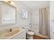 Bathroom featuring a vanity with a sink, a toilet, a shower-tub combo, and neutral finishes at 506 S Melville Ave, Tampa, FL 33606