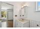 Bathroom featuring a vanity with an integrated sink, and a medicine cabinet at 506 S Melville Ave, Tampa, FL 33606