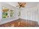 Bedroom with hardwood floors, large windows, and bright natural light at 506 S Melville Ave, Tampa, FL 33606