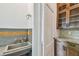 Butler pantry with concrete sink, granite counters, and view to another room at 506 S Melville Ave, Tampa, FL 33606
