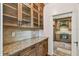 This spacious kitchen showcases wooden cabinets, granite countertops, and tiled backsplash at 506 S Melville Ave, Tampa, FL 33606