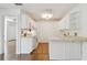 The kitchen features white cabinets and ample counter space at 506 S Melville Ave, Tampa, FL 33606