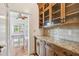 Stylish kitchen with granite counters, custom cabinets, and view to bonus room at 506 S Melville Ave, Tampa, FL 33606