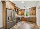 This spacious kitchen features stainless steel appliances and wood cabinets at 506 S Melville Ave, Tampa, FL 33606