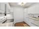 The kitchen features white cabinets and modern appliances at 506 S Melville Ave, Tampa, FL 33606