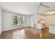 Living room with a large window looking out onto the lush, tropical landscaping at 506 S Melville Ave, Tampa, FL 33606
