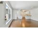 Bright living room with hardwood floors and a view into the kitchen at 506 S Melville Ave, Tampa, FL 33606