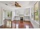 Spacious living room featuring hardwood floors, fireplace, and built-in shelving at 506 S Melville Ave, Tampa, FL 33606