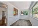 Bright living space with wood-look floors and a great view of the yard at 506 S Melville Ave, Tampa, FL 33606