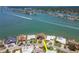 Gorgeous waterfront estate with a private dock, lush landscaping, and water views at 514 Harbor N Dr, Indian Rocks Beach, FL 33785