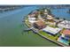 Waterfront property featuring a private dock, pool, and boat lift access to the open bay at 514 Harbor N Dr, Indian Rocks Beach, FL 33785
