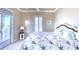 Charming bedroom featuring coastal-themed decor, plush carpeting, and ample natural light at 514 Harbor N Dr, Indian Rocks Beach, FL 33785