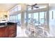 Bright dining area featuring a breakfast table with floor-to-ceiling windows and water views at 514 Harbor N Dr, Indian Rocks Beach, FL 33785