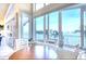 Bright dining area featuring a breakfast table with floor-to-ceiling windows and water views at 514 Harbor N Dr, Indian Rocks Beach, FL 33785