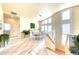 Elegant dining room with modern lighting, ample seating, and abundant natural light at 514 Harbor N Dr, Indian Rocks Beach, FL 33785