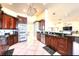 Spacious kitchen boasting dark wood cabinetry, stainless steel appliances, and ample countertop space at 514 Harbor N Dr, Indian Rocks Beach, FL 33785