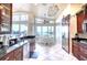 Bright kitchen with stainless steel appliances, granite countertops, and a breakfast nook overlooking the water at 514 Harbor N Dr, Indian Rocks Beach, FL 33785