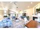 Open-concept living room boasts tile floors, a fireplace, and an abundance of natural light at 514 Harbor N Dr, Indian Rocks Beach, FL 33785