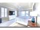 Main bedroom offers carpeted floors, water views, and a ceiling fan providing comfort and style at 514 Harbor N Dr, Indian Rocks Beach, FL 33785