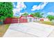 Charming single-story home featuring a red-trimmed roof, brick facade, spacious driveway, and well-kept landscaping at 521 E Lumsden Rd, Brandon, FL 33511
