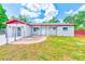 Charming single-story home featuring a brick exterior, well-manicured lawn, and inviting front porch at 521 E Lumsden Rd, Brandon, FL 33511