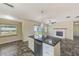 Spacious kitchen and living area with tiled floors, a large window, and modern appliances at 521 E Lumsden Rd, Brandon, FL 33511