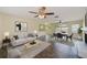 Open concept living and dining area with fireplace, stylish furnishings, and tile flooring at 521 E Lumsden Rd, Brandon, FL 33511