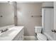 Well-lit bathroom with a white vanity, toilet, and shower-tub combination at 5306 Marlwood Ct, Tampa, FL 33624