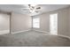 Spacious bedroom with neutral tones, a ceiling fan and plush carpeting at 5306 Marlwood Ct, Tampa, FL 33624