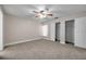 Bedroom features a ceiling fan, neutral tones and large closets at 5306 Marlwood Ct, Tampa, FL 33624