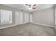 Bright bedroom featuring three large closets, a window and neutral tones at 5306 Marlwood Ct, Tampa, FL 33624