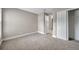 Bedroom with a closet and open door; offering a view to the next room at 5306 Marlwood Ct, Tampa, FL 33624