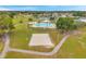 Community recreation features outdoor pool, volleyball court, playground, and tennis courts at 5306 Marlwood Ct, Tampa, FL 33624