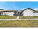 Charming single-story home featuring a well-maintained lawn and a private front entrance at 5306 Marlwood Ct, Tampa, FL 33624