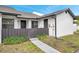Welcoming front entrance featuring a dark brown fence and secure access to the home at 5306 Marlwood Ct, Tampa, FL 33624