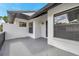 Relaxing front porch area ideal for seating and enjoying the outdoors with dark trim at 5306 Marlwood Ct, Tampa, FL 33624