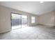 Living room featuring a sliding glass door for easy outdoor access at 5306 Marlwood Ct, Tampa, FL 33624