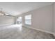 Bright living area features tile floors and slider door to back yard at 5306 Marlwood Ct, Tampa, FL 33624