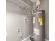 The utility room features a water heater and storage shelf for added convenience at 5306 Marlwood Ct, Tampa, FL 33624