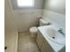 Compact bathroom featuring a shower and vanity sink, with neutral colors at 6102 Massachusetts Ave, New Port Richey, FL 34653