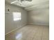 Spacious living room with AC unit and tiled flooring at 6102 Massachusetts Ave, New Port Richey, FL 34653