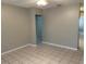 Neutral living room with tile floors, perfect for relaxing and entertaining at 6102 Massachusetts Ave, New Port Richey, FL 34653