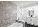 Well-appointed bathroom with modern fixtures, a stylish vanity, and a tub shower, for a comfortable and relaxing experience at 622 Cedar Grove Dr, Brandon, FL 33511